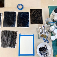 a table set up for painting papers
