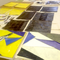 papers painted black, blue, white and yellow