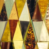a close up of painted papers